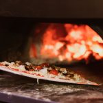how do you heat an outdoor pizza oven