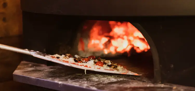 how do you heat an outdoor pizza oven